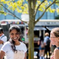 Professor conversing with student